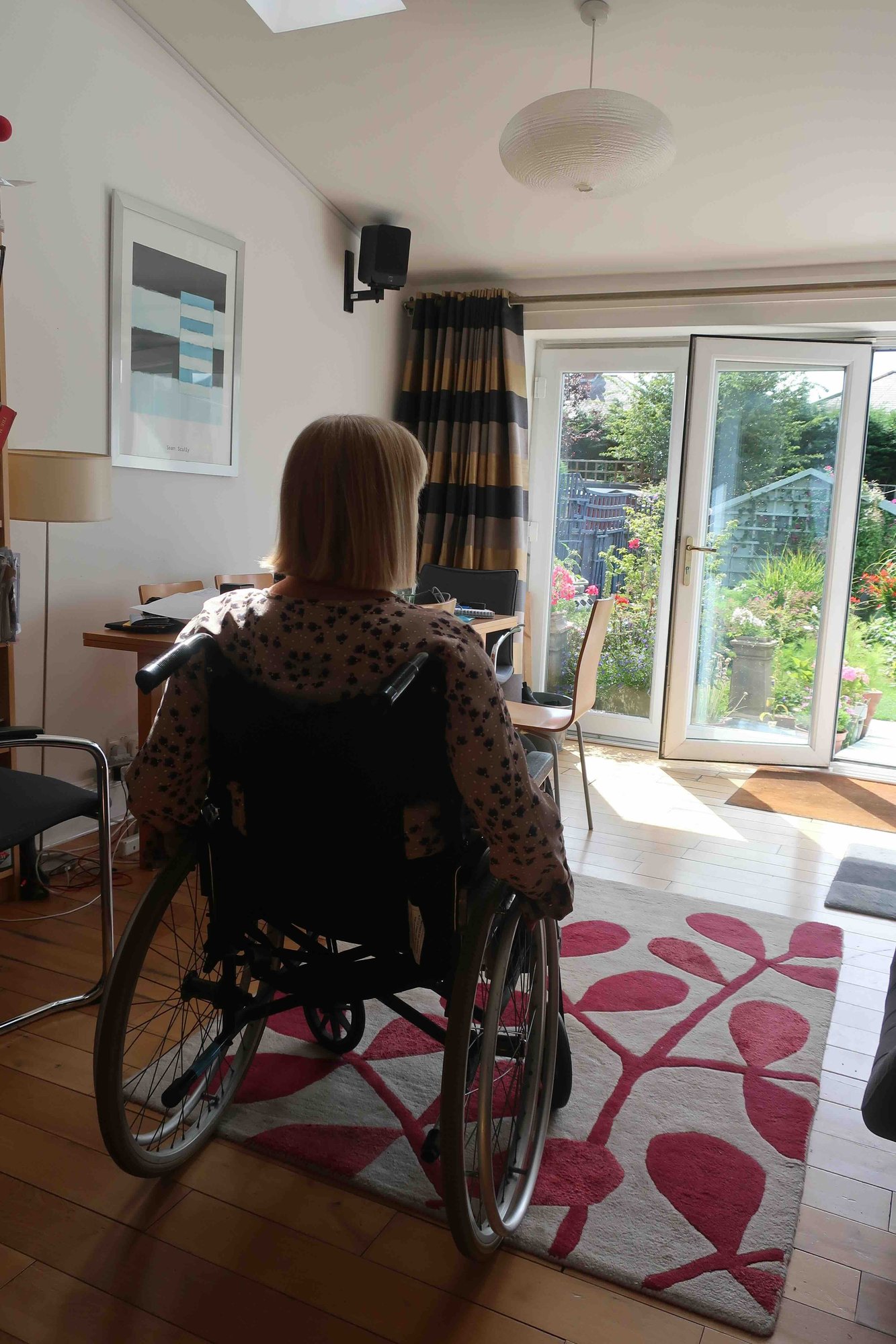 Lady looking out at garden